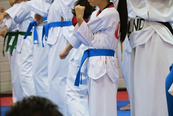 TaeKwonDo students with different colored belts training together at a martial arts school