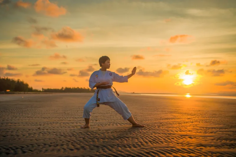 Adult students training self defense techniques in a martial arts class