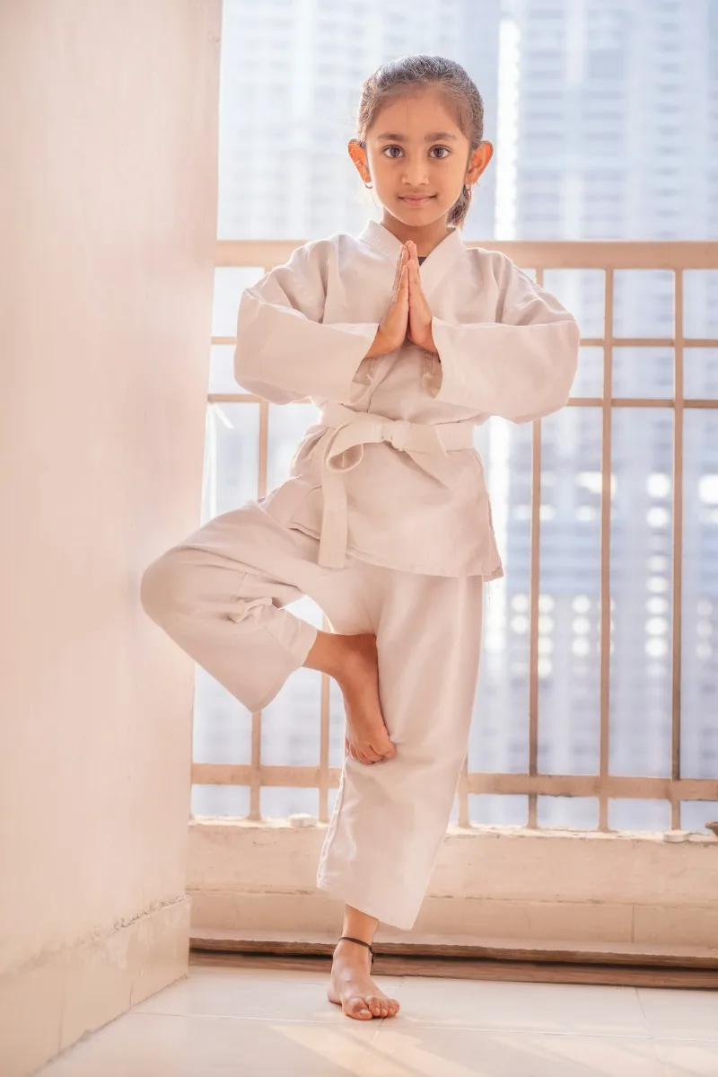 Young martial arts student focused during belt rank training session