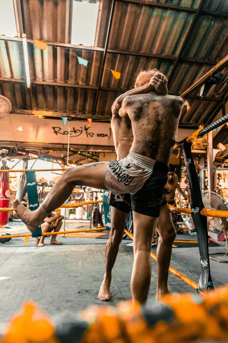 Martial arts instructor demonstrating joint lock restraint technique for self defense