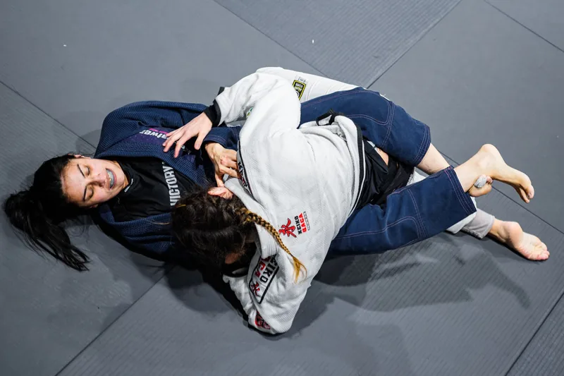 Grapplers drilling positional control, one of the core physical benefits of jiu jitsu training