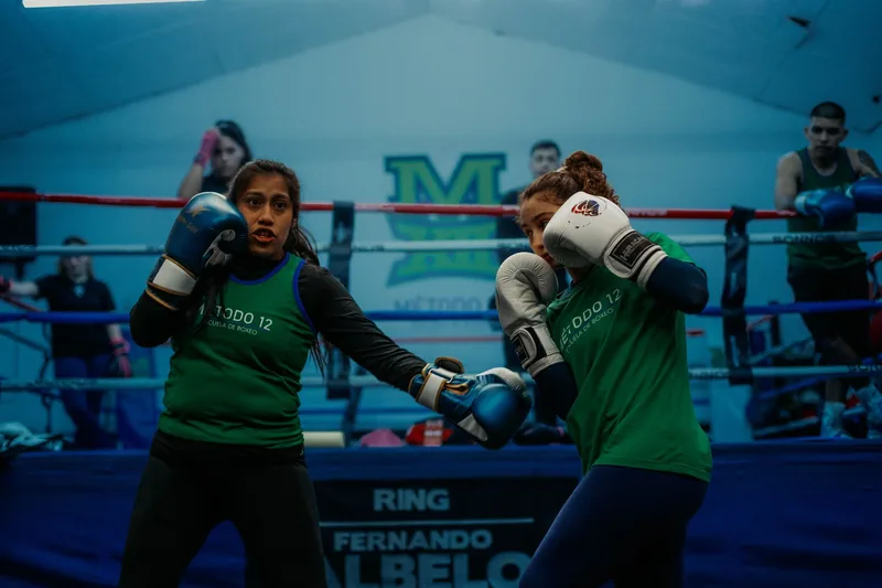 Female students building confidence through regular self defense training at a martial arts gym