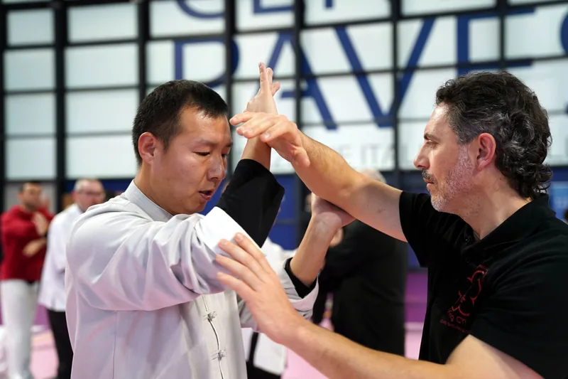 Wing Chun practitioners training close-range contact drills and centerline control
