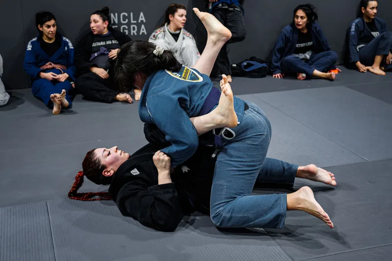 New students training in a beginner BJJ class, where most bjj white belt tips start paying off