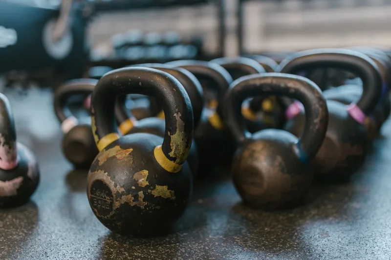 Kettlebell on a gym floor used for power and conditioning work in MMA training