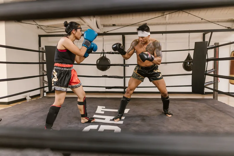 Training partners with hands up in a protective guard, a core skill for defending yourself in a fight